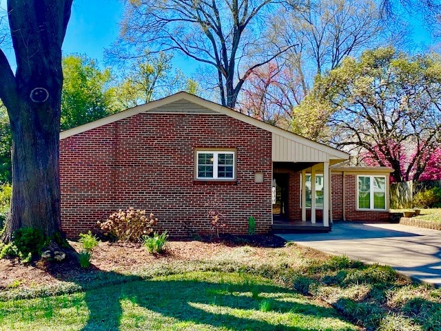 503 Williamsburg Dr, Dalton, GA 30720 - view of front of property with a patio, concrete driveway, brick siding, and a front lawn