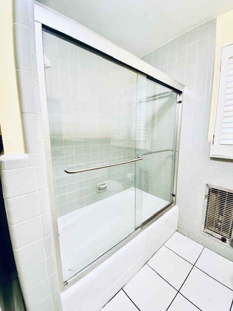 503 Williamsburg Dr, Dalton, GA 30720 - full bath with bath / shower combo with glass door, tile walls, and tile patterned flooring