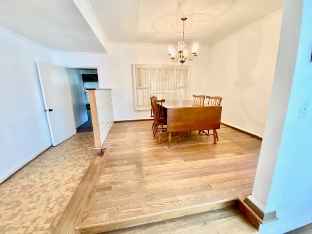 503 Williamsburg Dr, Dalton, GA 30720 - dining area with crown molding, a notable chandelier, and light wood-style floors