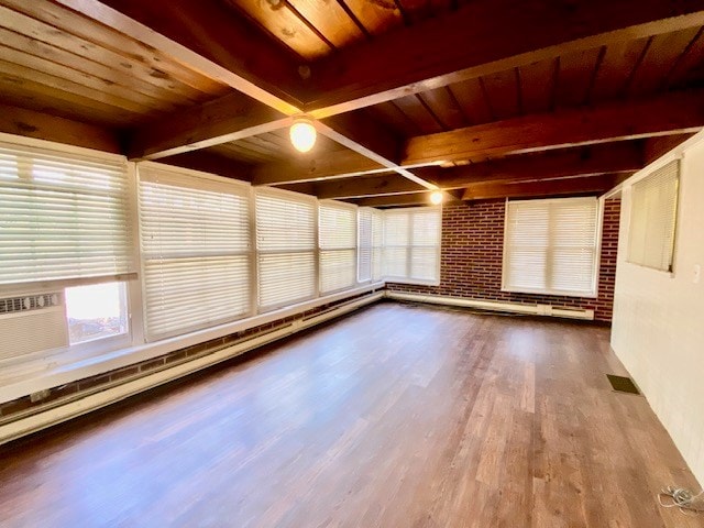 503 Williamsburg Dr, Dalton, GA 30720 - empty room featuring visible vents, brick wall, beamed ceiling, baseboard heating, and wood finished floors