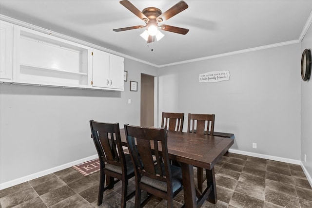 dining area with crown molding and ceiling fan