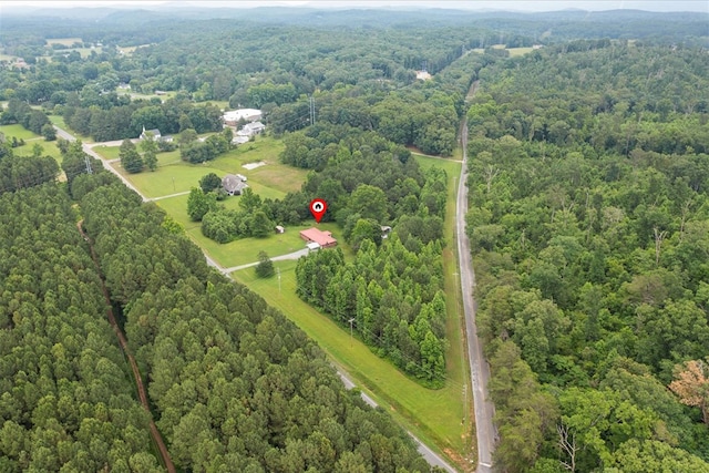 birds eye view of property with a rural view