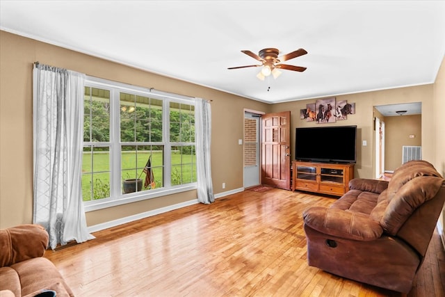 living room with ceiling fan and light wood-type flooring