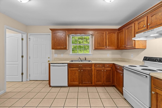 120 Loudermilk Rd, Chatsworth, GA 30721 - kitchen with white appliances, under cabinet range hood, light countertops, and light tile patterned floors