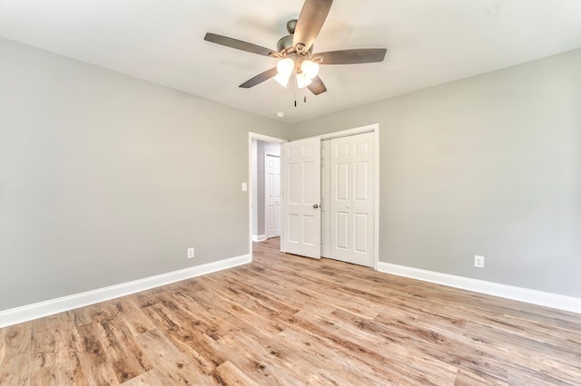 unfurnished bedroom featuring a closet, ceiling fan, and light hardwood / wood-style flooring