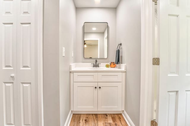 bathroom featuring vanity and hardwood / wood-style floors