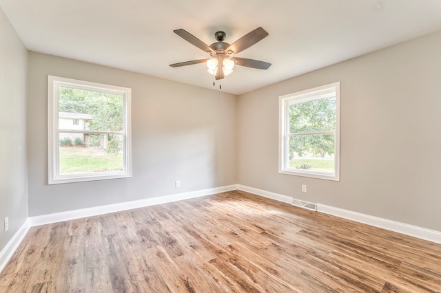 spare room with ceiling fan and light hardwood / wood-style flooring