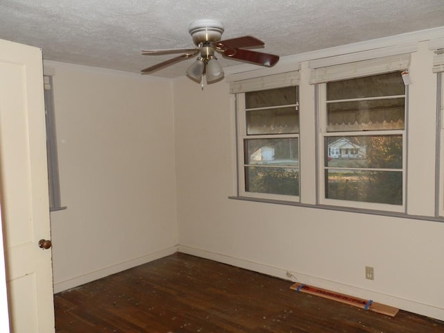unfurnished room with wood finished floors, baseboards, ceiling fan, ornamental molding, and a textured ceiling