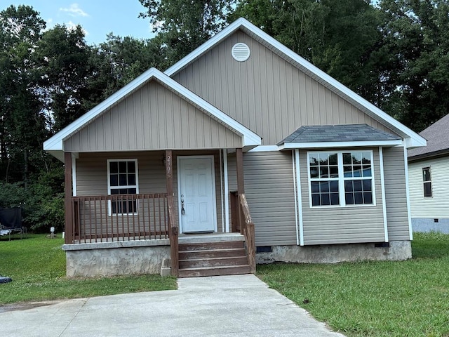 2305 Epperson Dr, Dalton, GA 30721 - view of front facade featuring a porch, a front lawn, and crawl space