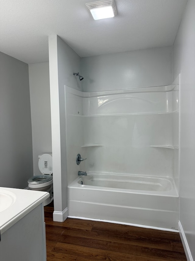 2305 Epperson Dr, Dalton, GA 30721 - full bath with vanity, wood finished floors, shower / tub combination, and a textured ceiling