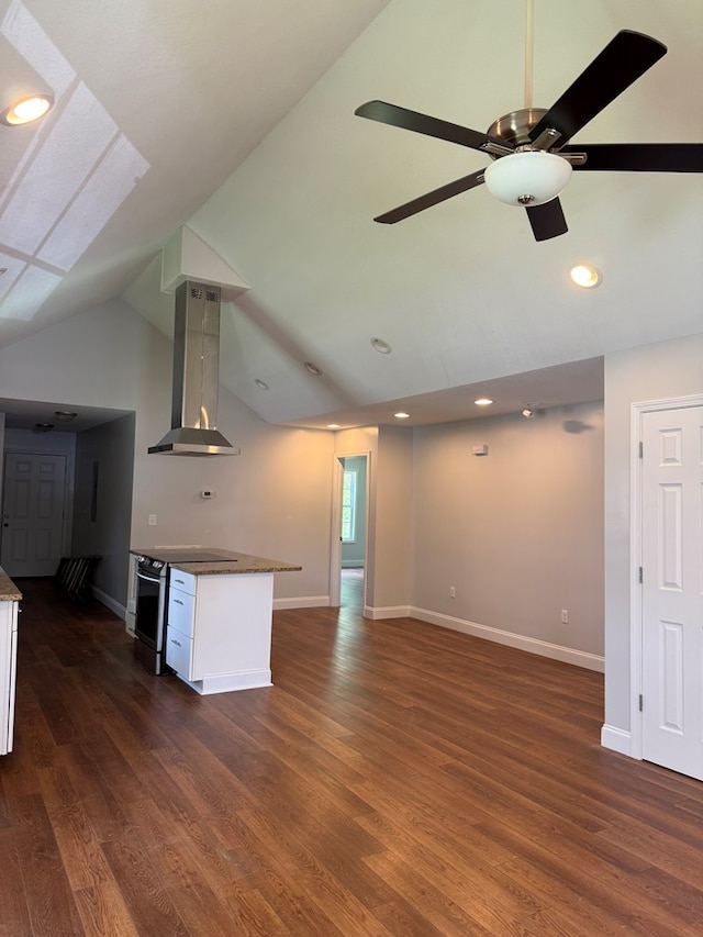 2305 Epperson Dr, Dalton, GA 30721 - unfurnished living room featuring dark wood finished floors, vaulted ceiling, a ceiling fan, and recessed lighting