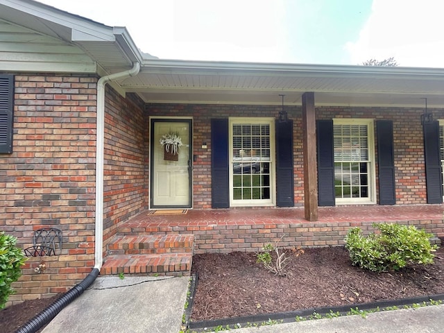 1229 Valencia Dr, Dalton, GA 30720 - entrance to property with covered porch and brick siding