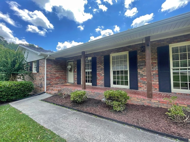 1229 Valencia Dr, Dalton, GA 30720 - view of exterior entry with covered porch and brick siding