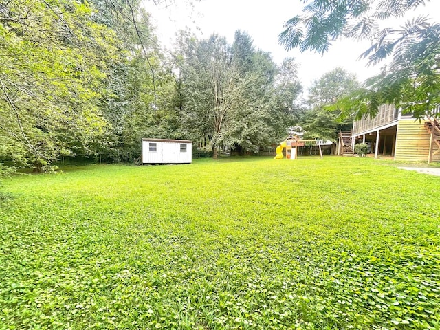 1229 Valencia Dr, Dalton, GA 30720 - view of green lawn with a storage shed and stairs