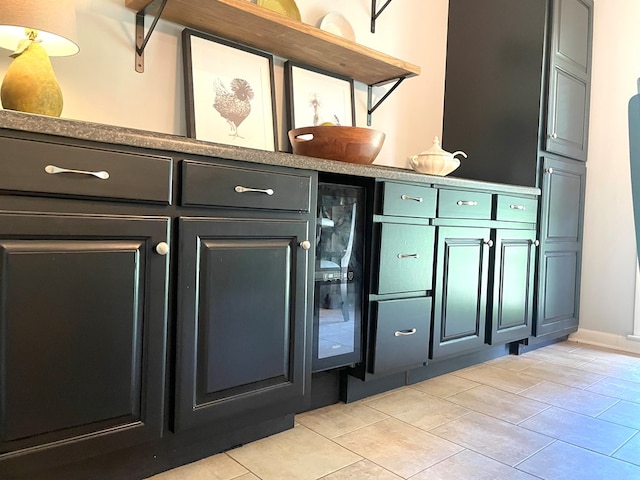 1229 Valencia Dr, Dalton, GA 30720 - bar featuring beverage cooler and light tile patterned flooring