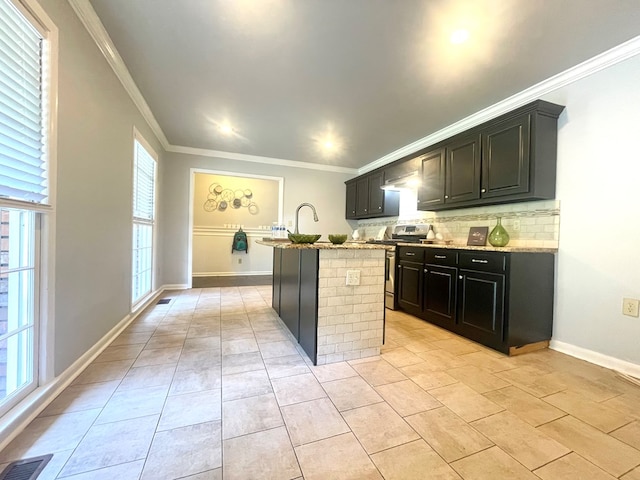 1229 Valencia Dr, Dalton, GA 30720 - kitchen featuring backsplash, ornamental molding, stainless steel stove, healthy amount of natural light, and light stone countertops