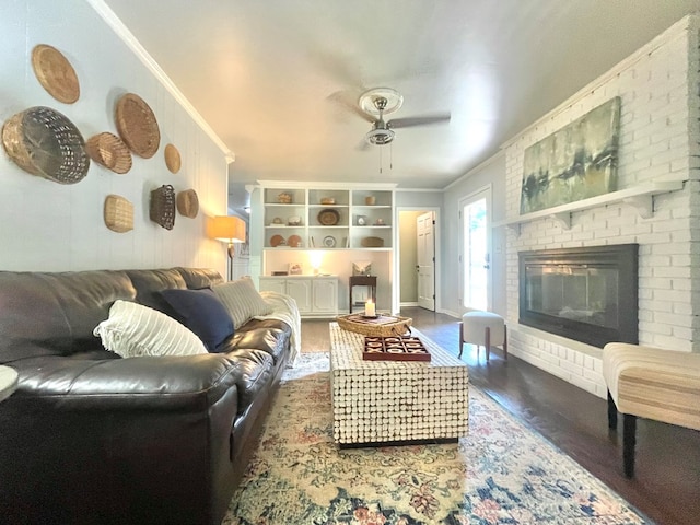 1229 Valencia Dr, Dalton, GA 30720 - living area featuring crown molding, wood finished floors, ceiling fan, and a fireplace