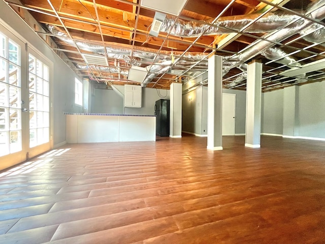 1229 Valencia Dr, Dalton, GA 30720 - basement with freestanding refrigerator and wood finished floors