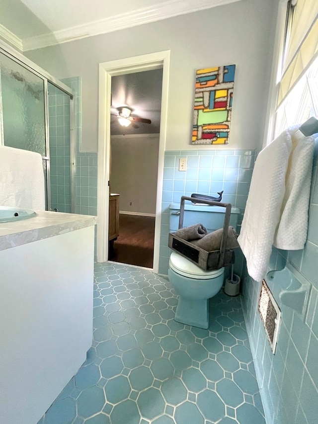 1229 Valencia Dr, Dalton, GA 30720 - full bath featuring ornamental molding, tile walls, vanity, a stall shower, and ceiling fan