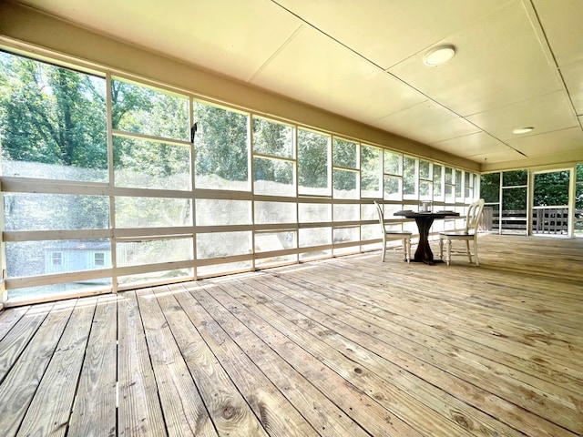 1229 Valencia Dr, Dalton, GA 30720 - unfurnished sunroom with hardwood / wood-style floors, outdoor dining area, and a wooden deck