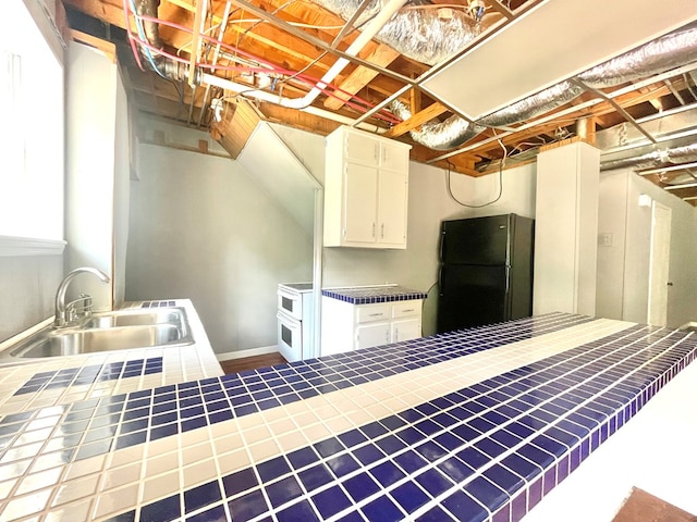 1229 Valencia Dr, Dalton, GA 30720 - below grade area with freestanding refrigerator and a sink