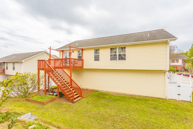 128 Andasol Way, Dalton, GA 30720 - back of property featuring stairway, a wooden deck, a vegetable garden, fence, and a yard