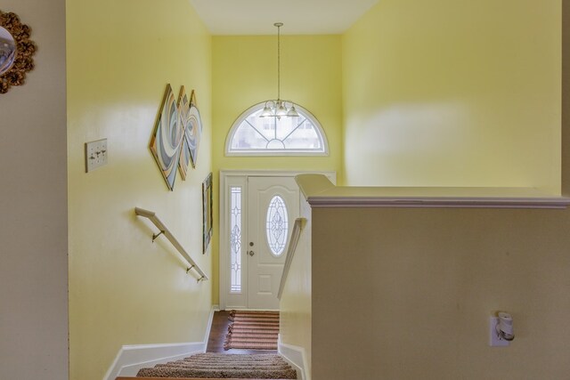 128 Andasol Way, Dalton, GA 30720 - foyer with a towering ceiling, a notable chandelier, baseboards, and stairs
