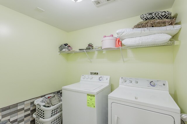 128 Andasol Way, Dalton, GA 30720 - laundry room with visible vents, laundry area, and separate washer and dryer