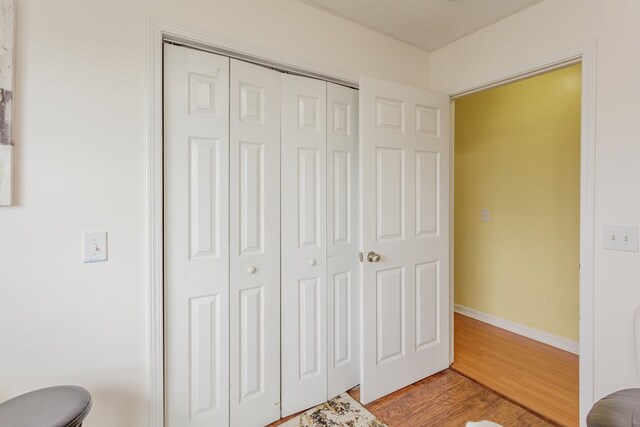 128 Andasol Way, Dalton, GA 30720 - bedroom with baseboards, a closet, and light wood finished floors