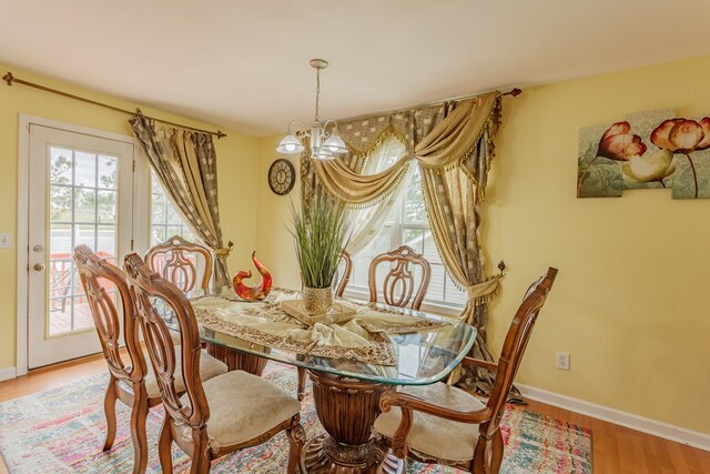 128 Andasol Way, Dalton, GA 30720 - dining space featuring baseboards, a chandelier, and wood finished floors