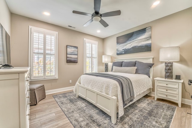 bedroom featuring ceiling fan and light hardwood / wood-style floors