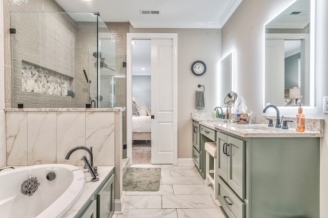 bathroom with vanity, ornamental molding, and separate shower and tub