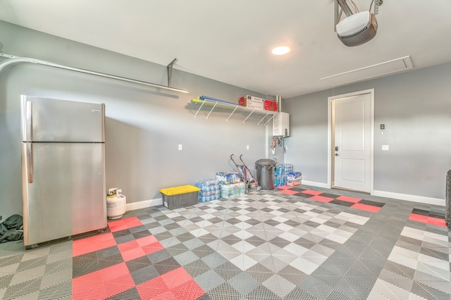 garage featuring stainless steel refrigerator and a garage door opener