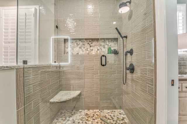 bathroom featuring an enclosed shower