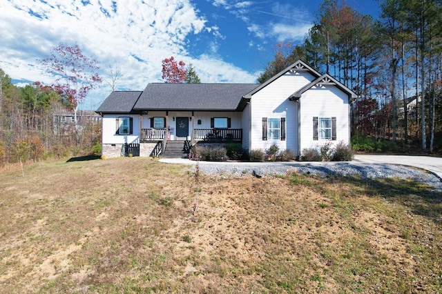 view of front facade with a porch and a front lawn