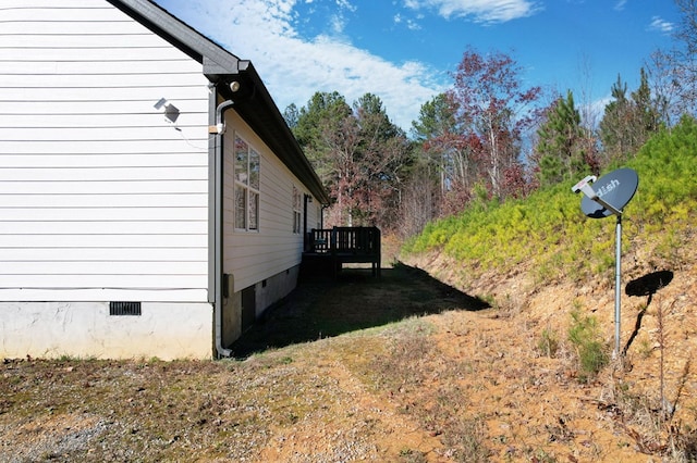 view of side of home featuring a deck