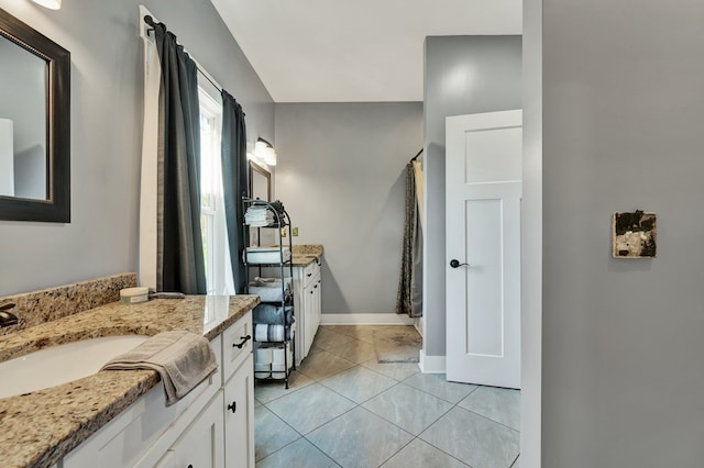 bathroom with vanity and tile patterned flooring