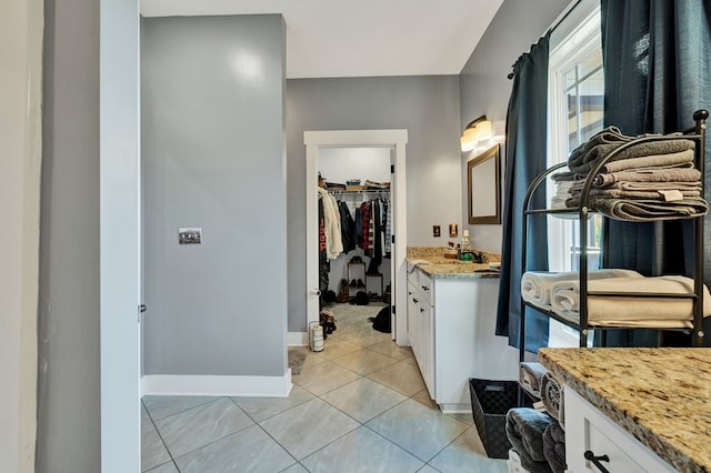 bathroom with vanity and tile patterned floors