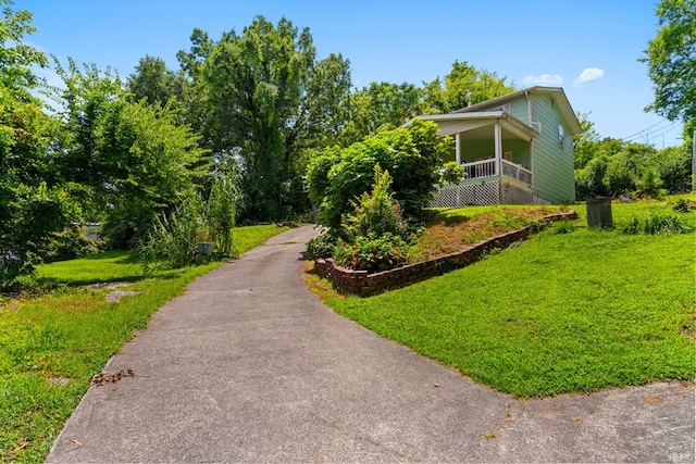 1369 Lida St, Dalton, GA 30721 - view of side of property featuring driveway and a lawn