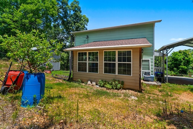 1369 Lida St, Dalton, GA 30721 - rear view of house featuring a carport