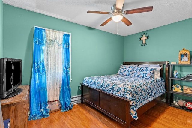 1369 Lida St, Dalton, GA 30721 - bedroom with wood finished floors, a ceiling fan, and a textured ceiling