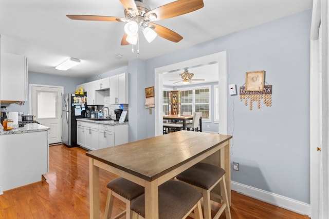 1369 Lida St, Dalton, GA 30721 - dining area featuring wood finished floors and ceiling fan