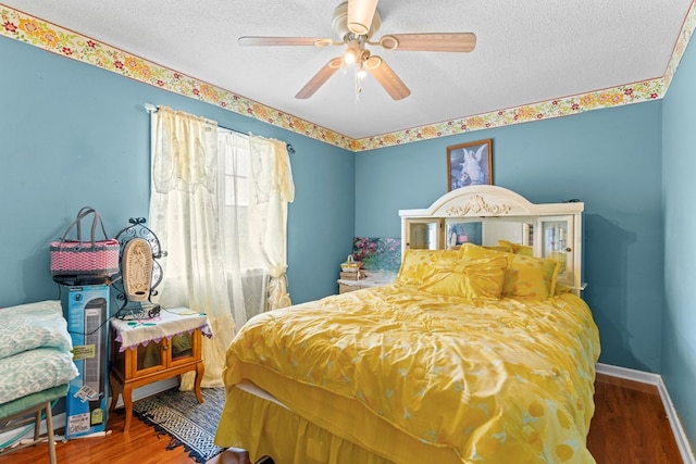 1369 Lida St, Dalton, GA 30721 - bedroom featuring a textured ceiling, wood finished floors, and a ceiling fan