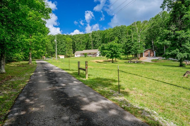 2163 Red Leaf Ln, Soddy Daisy, TN 37379 - view of asphalt driveway featuring a forest view
