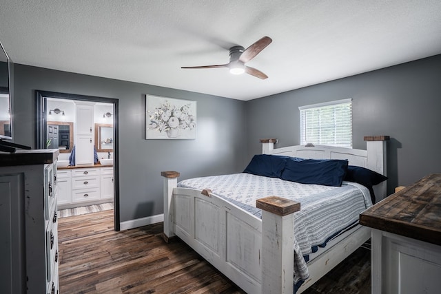 2163 Red Leaf Ln, Soddy Daisy, TN 37379 - bedroom featuring dark wood-style floors, a ceiling fan, and a textured ceiling