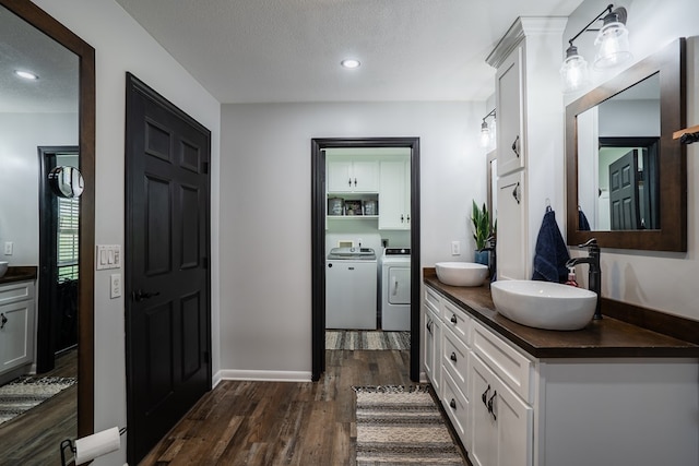 2163 Red Leaf Ln, Soddy Daisy, TN 37379 - bathroom featuring independent washer and dryer, double vanity, wood finished floors, recessed lighting, and a textured ceiling