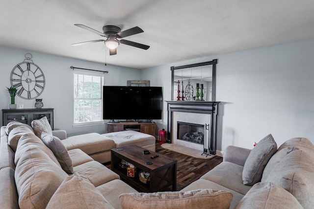 2163 Red Leaf Ln, Soddy Daisy, TN 37379 - living area featuring a fireplace with flush hearth, ceiling fan, and wood finished floors