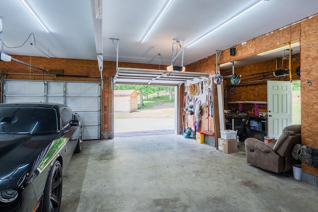 2163 Red Leaf Ln, Soddy Daisy, TN 37379 - garage featuring a storage shed