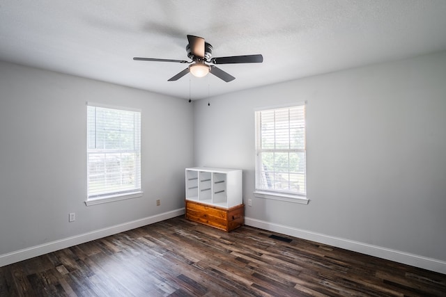 2163 Red Leaf Ln, Soddy Daisy, TN 37379 - spare room featuring healthy amount of natural light, dark wood-type flooring, and ceiling fan