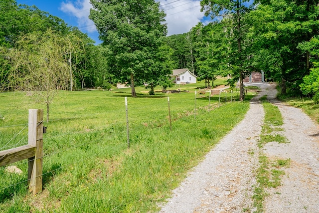 2163 Red Leaf Ln, Soddy Daisy, TN 37379 - view of yard with an outdoor structure and a wooded view